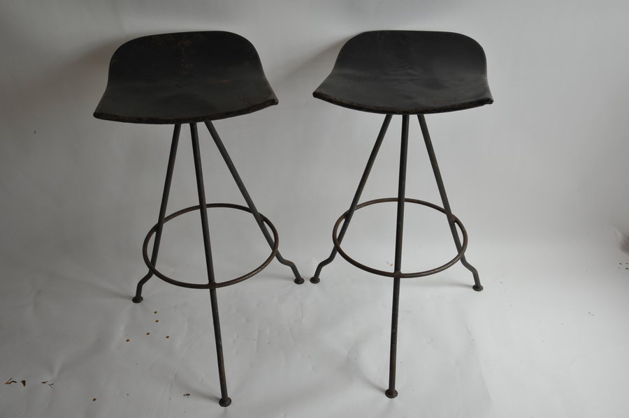 sturdy vintage metal pair of black stools against white background