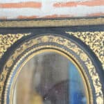 antique french ebonised and gilt wall mirror