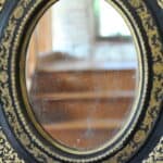 antique french ebonised and gilt wall mirror