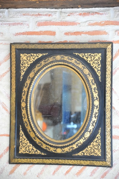 antique french ebonised and gilt wall mirror
