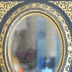 antique french ebonised and gilt wall mirror