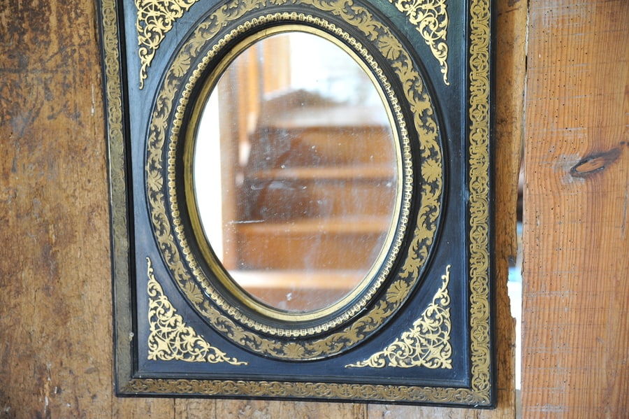 antique french ebonised and gilt wall mirror