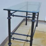 cast metal and glass giacommetti inspired console