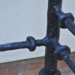 cast metal and glass giacommetti inspired console