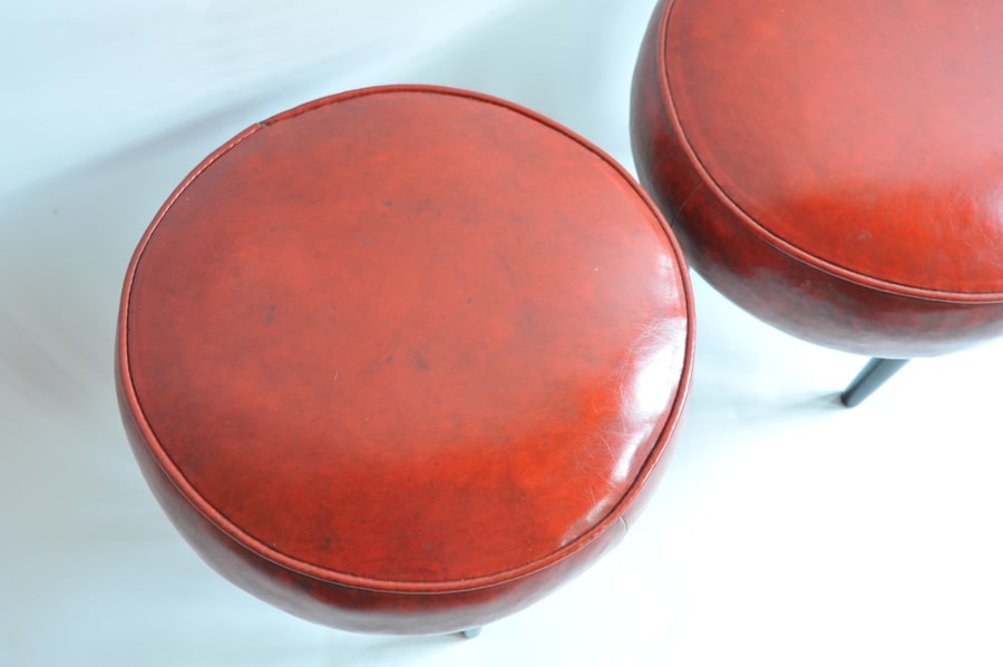 pair of vintage mid century upholstered foot stools