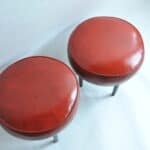 pair of vintage mid century upholstered foot stools