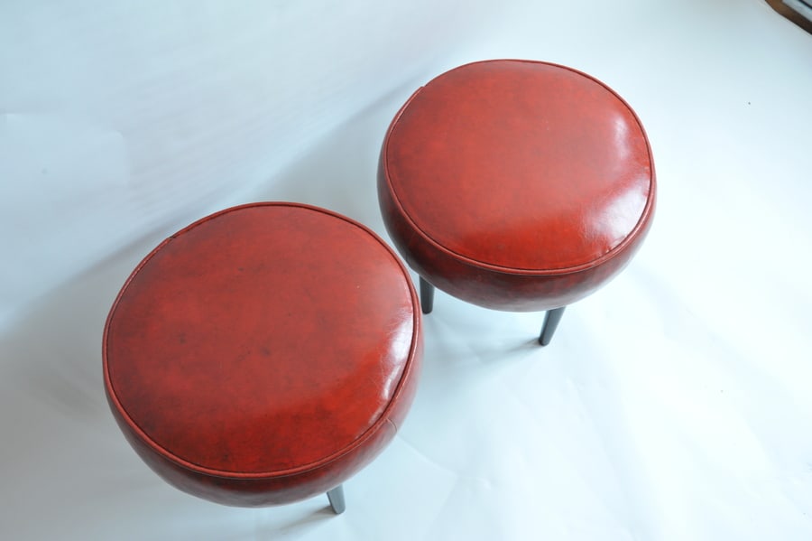 pair of vintage mid century upholstered foot stools