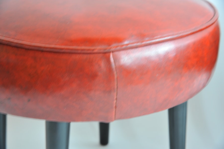 pair of vintage mid century upholstered foot stools