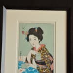 a pair of vintage japanese wood block prints