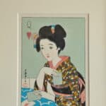 a pair of vintage japanese wood block prints