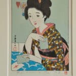 a pair of vintage japanese wood block prints