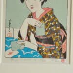 a pair of vintage japanese wood block prints