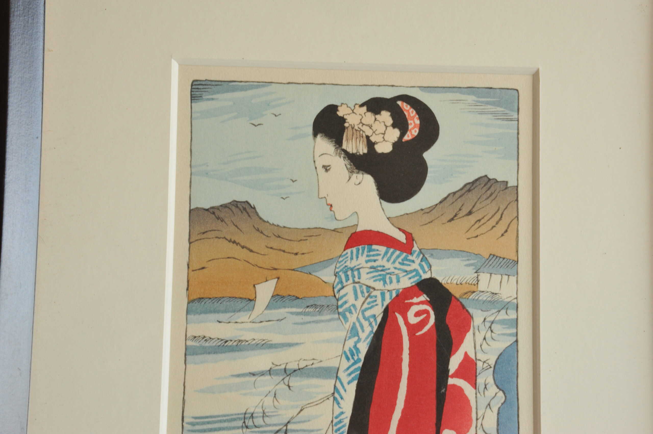 a pair of vintage japanese wood block prints