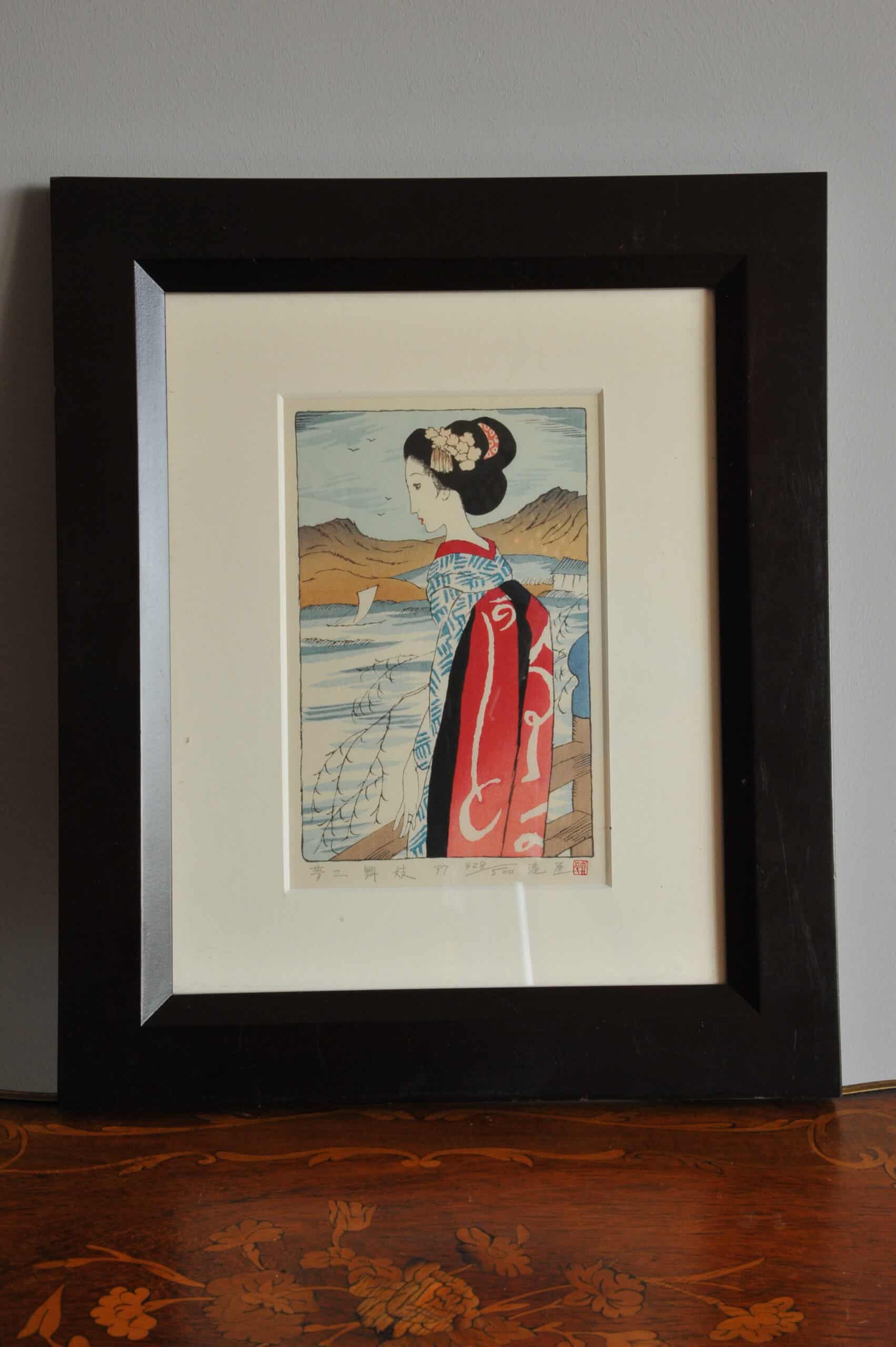 a pair of vintage japanese wood block prints