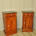 a pair of antique french walnut bedside cabinets