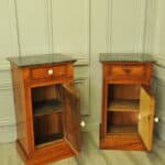 a pair of antique french walnut bedside cabinets