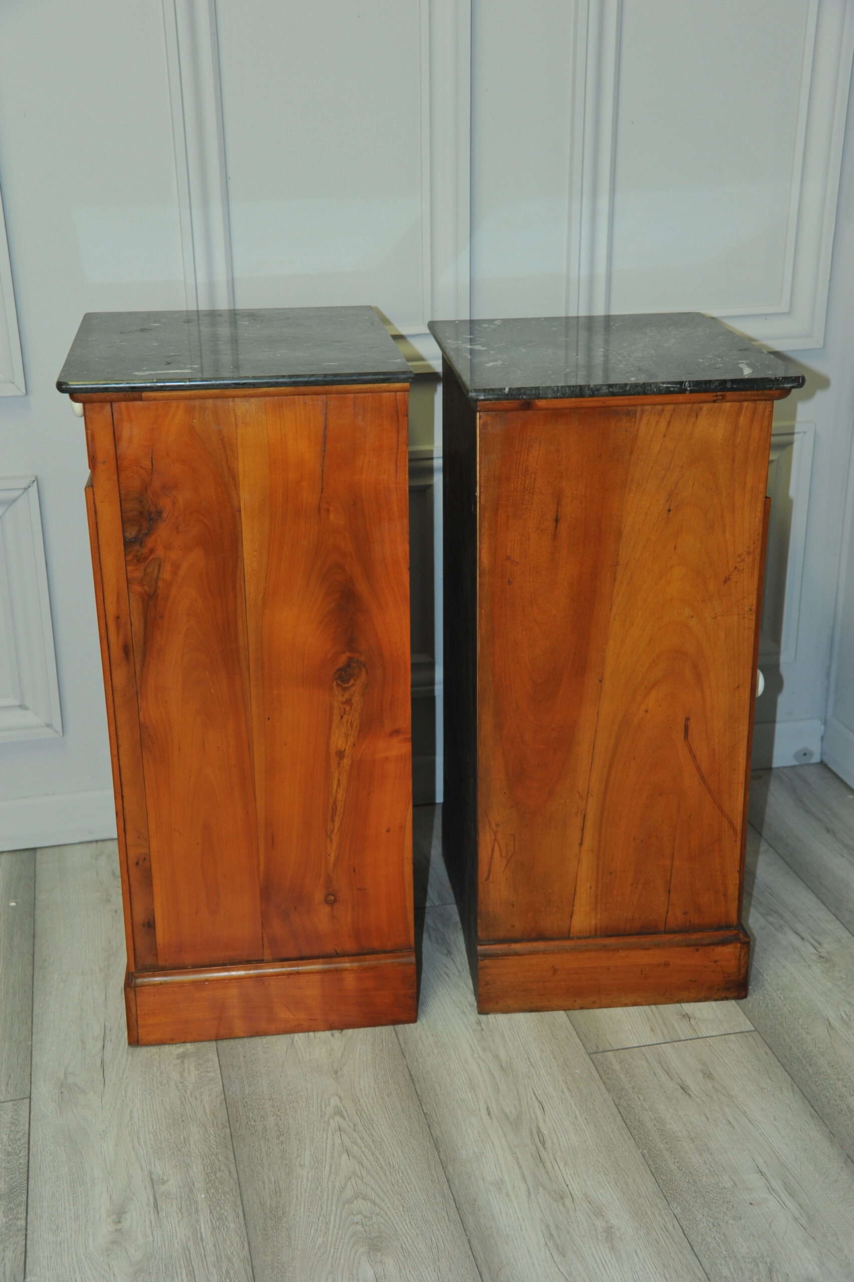 a pair of antique french walnut bedside cabinets