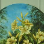 a beautiful vintage hand painted plate with lillies
