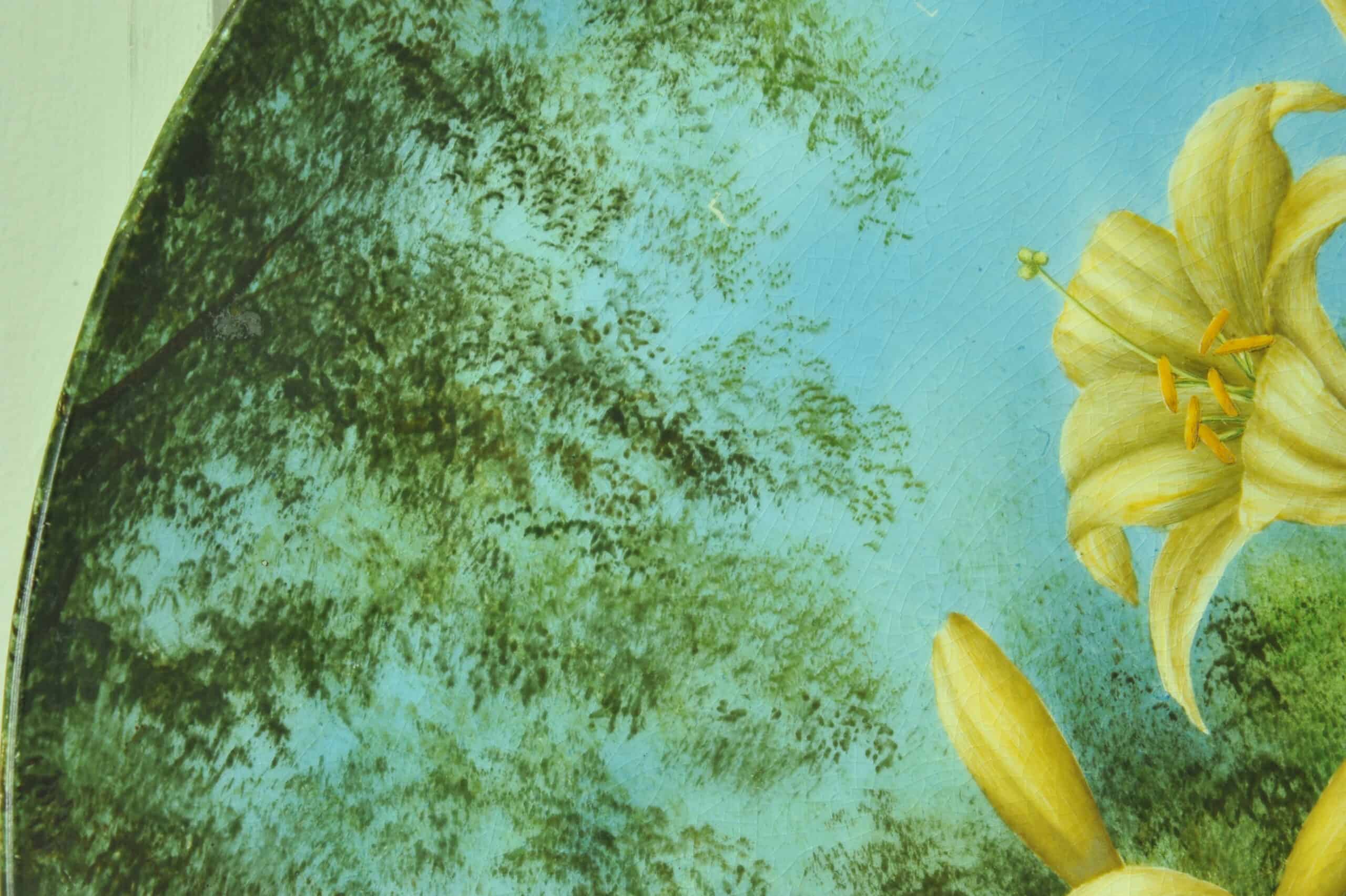 a beautiful vintage hand painted plate with lillies
