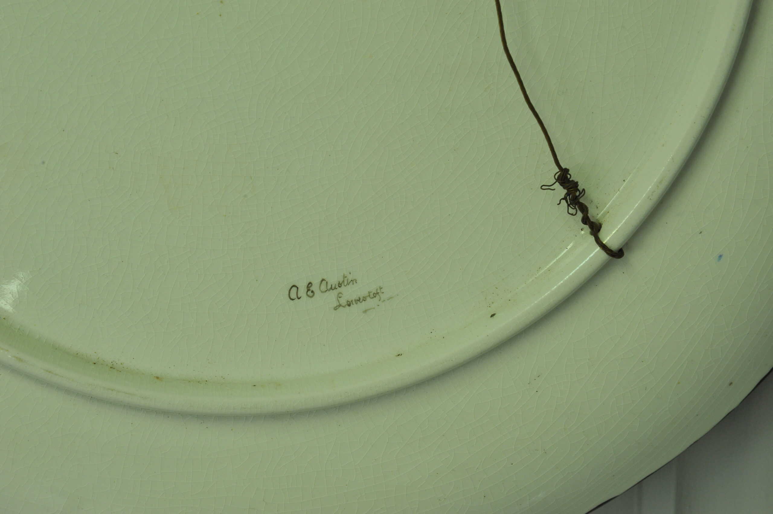 a beautiful vintage hand painted plate with lillies