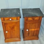 a pair of antique french walnut bedside cabinets