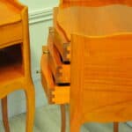 a lovely pair of mid c french satinwood bedside tables