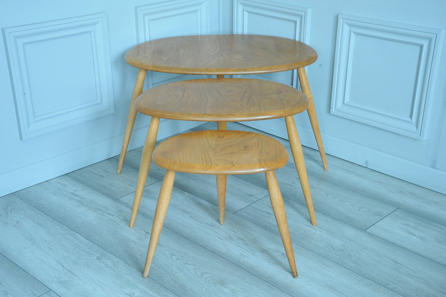 a vintage set of ercol pebble nesting tables