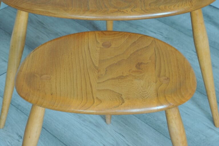 a vintage set of ercol pebble nesting tables