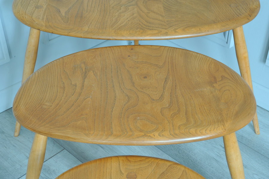 a vintage set of ercol pebble nesting tables