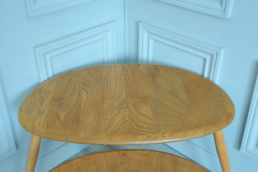 a vintage set of ercol pebble nesting tables