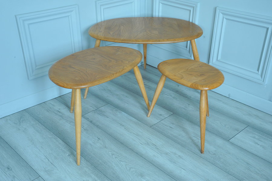a vintage set of ercol pebble nesting tables