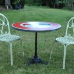 a vintage french cast iron road sign bistro café table