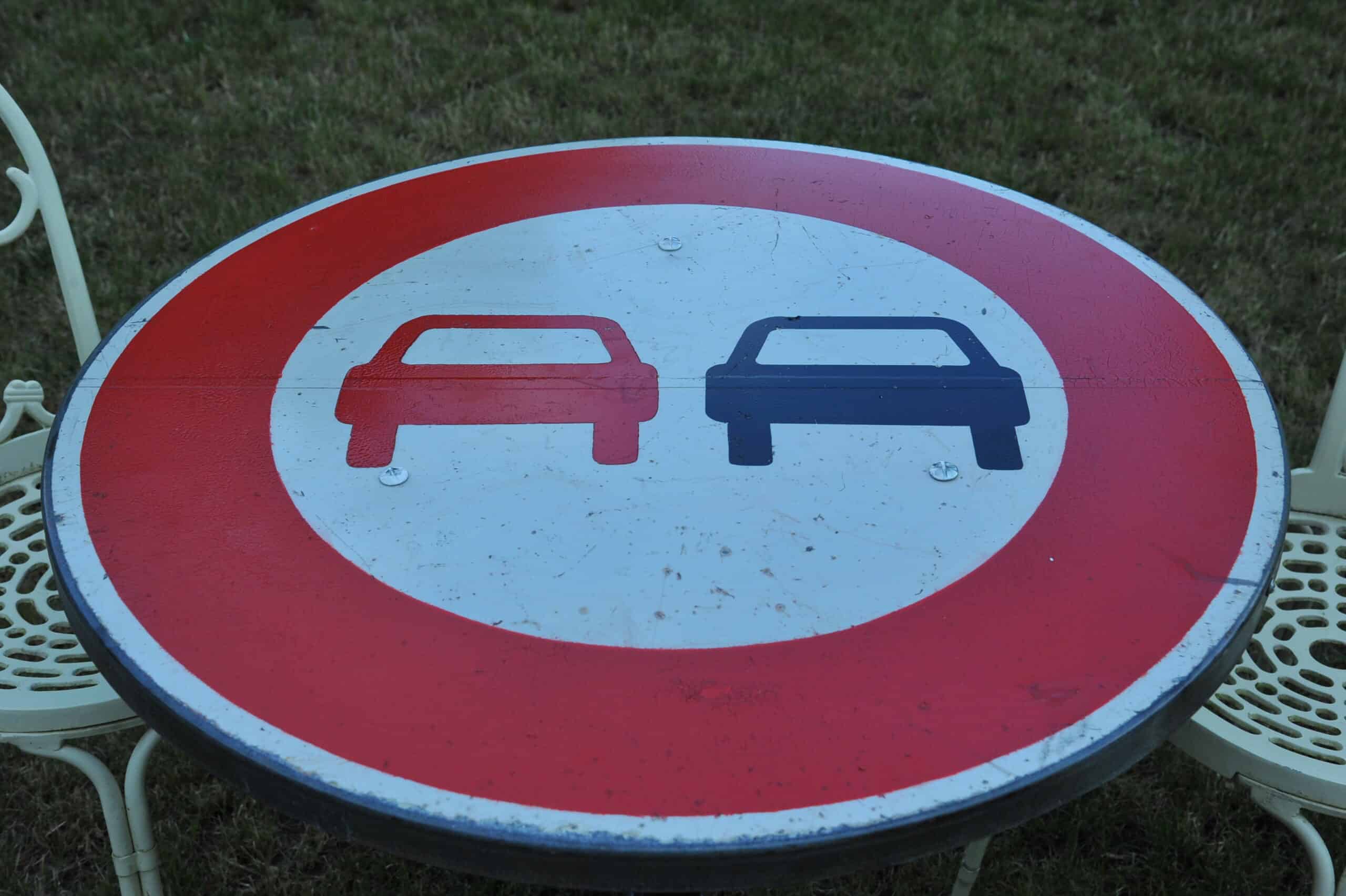 a vintage french cast iron road sign bistro café table