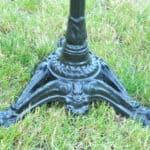 a vintage french cast iron road sign bistro café table