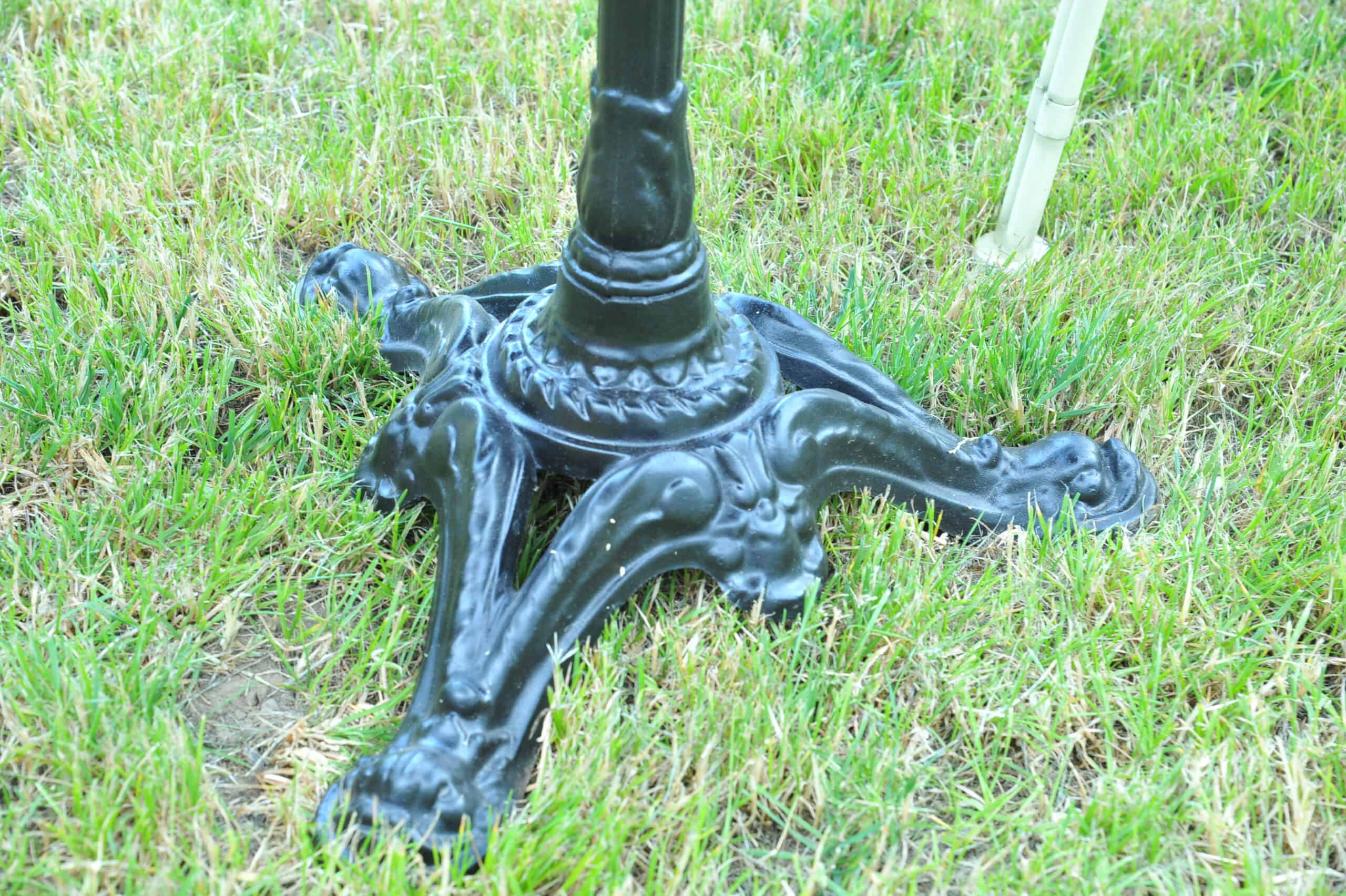 a vintage french cast iron road sign bistro café table