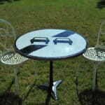 a vintage french cast iron road sign bistro café table