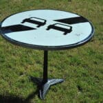 a vintage french cast iron road sign bistro café table