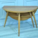 a vintage ercol round single drop leaf occasional table