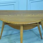 a vintage ercol round single drop leaf occasional table