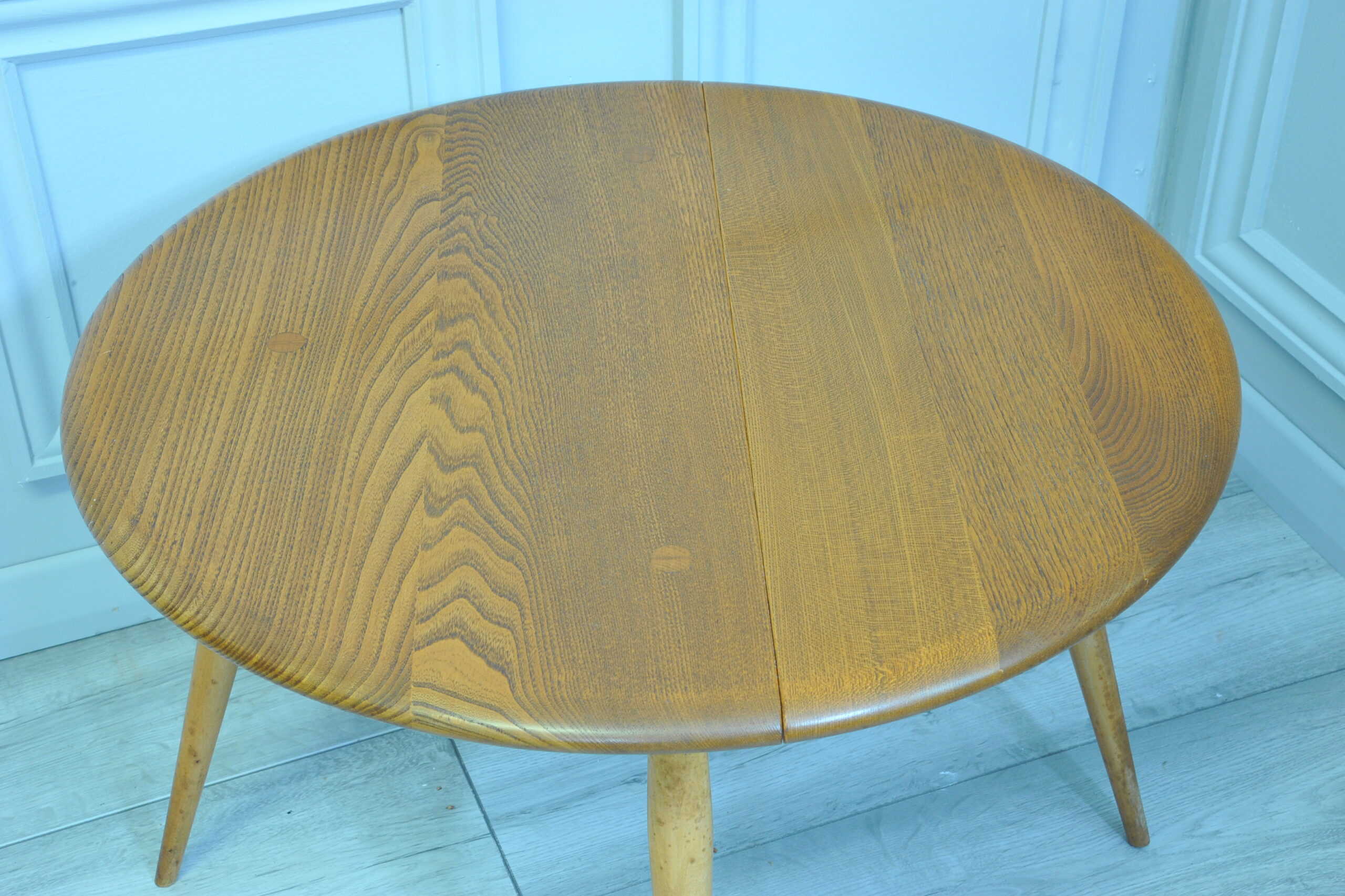 a vintage ercol round single drop leaf occasional table