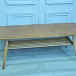 a vintage ercol long coffee table with under shelf