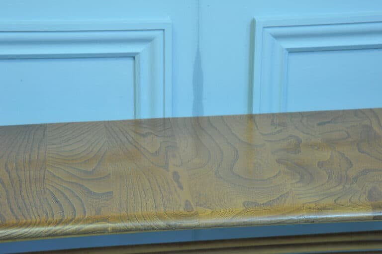 a vintage ercol long coffee table with under shelf