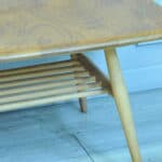 a vintage ercol long coffee table with under shelf