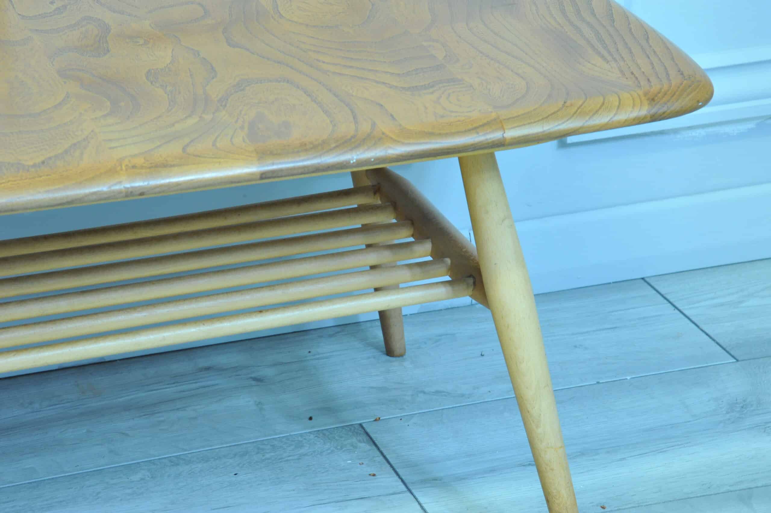 a vintage ercol long coffee table with under shelf