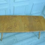 a vintage ercol long coffee table with under shelf