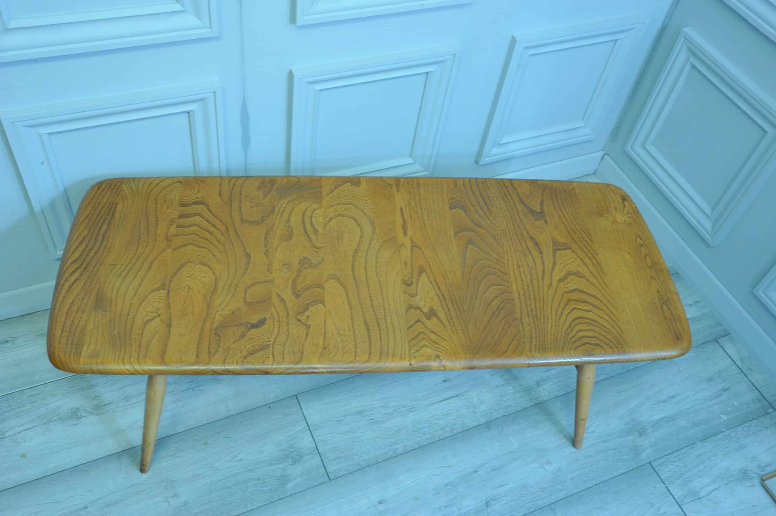 a vintage ercol long coffee table with under shelf