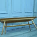 a vintage ercol long coffee table with under shelf