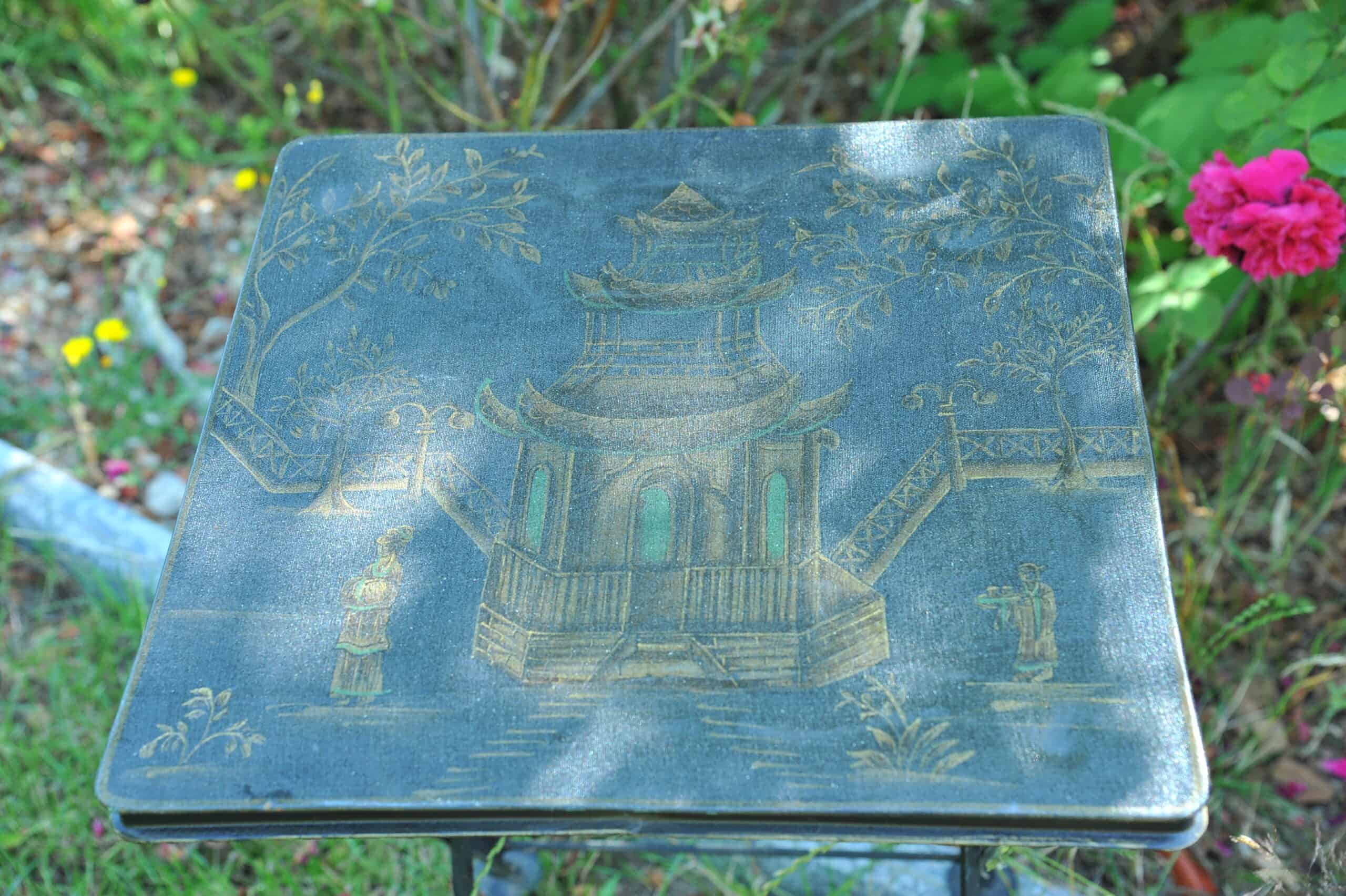 a vintage chinoiseries top metal folding table