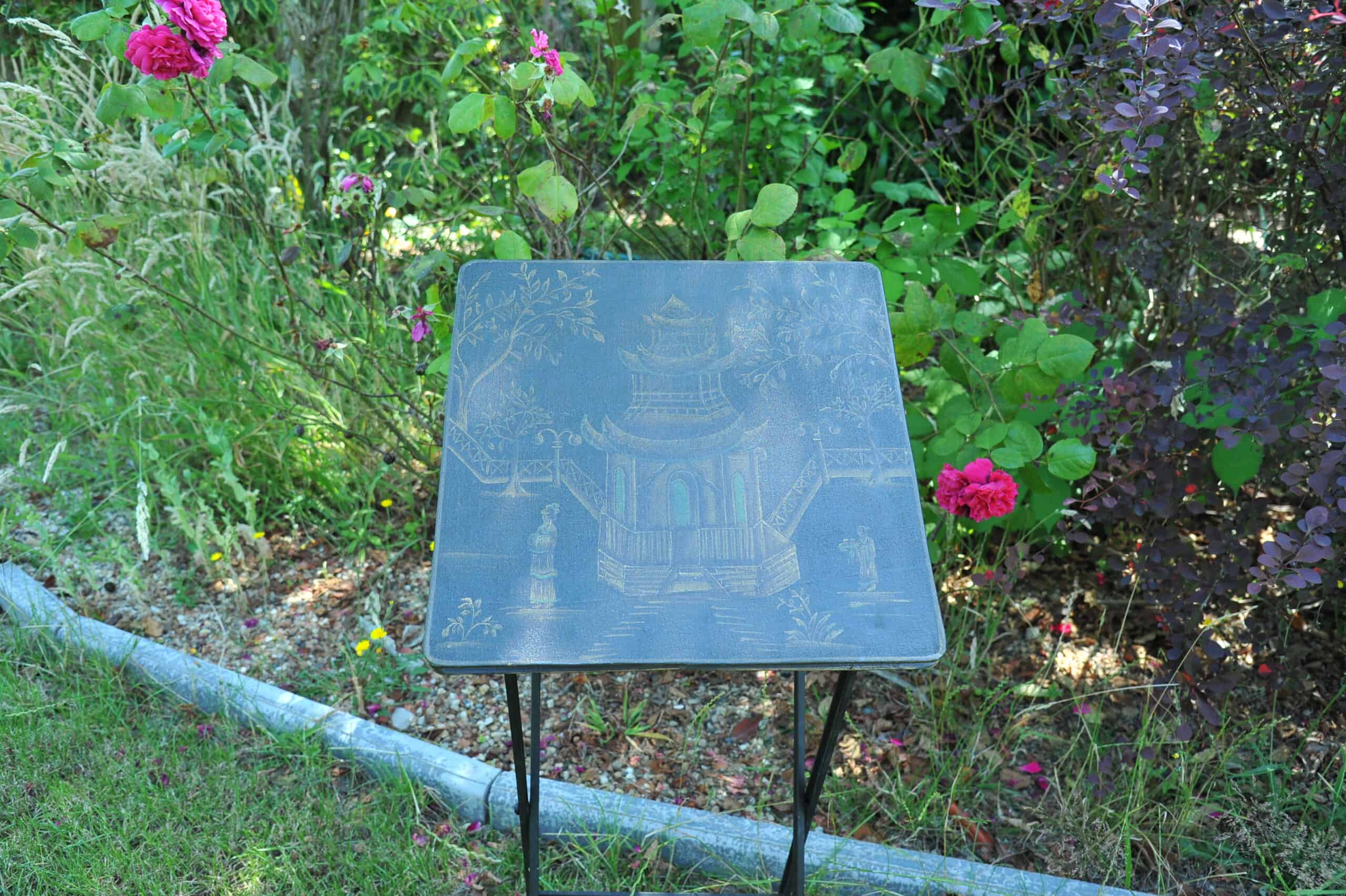 a vintage chinoiseries top metal folding table