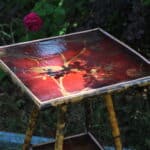 a good antique vintage two tier bamboo and lacquered panel side table